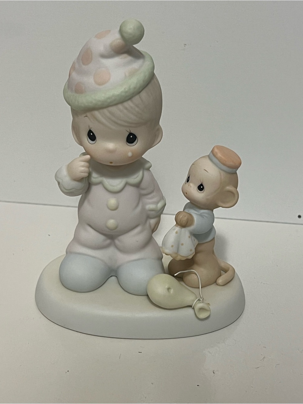 Vintage Precious Moments figurine titled “Somebody Cares” from 1997